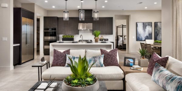 Family Room to Kitchen of Alba Elite model at Acadia Ridge by Toll Brothers